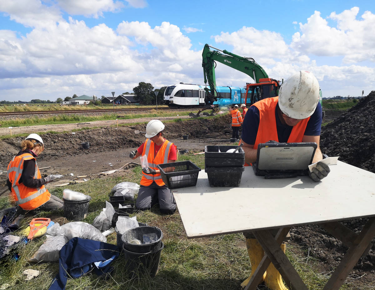 De archeologen aan het werk